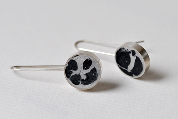 Pigmented concrete drop earrings cast within a sterling silver frame.